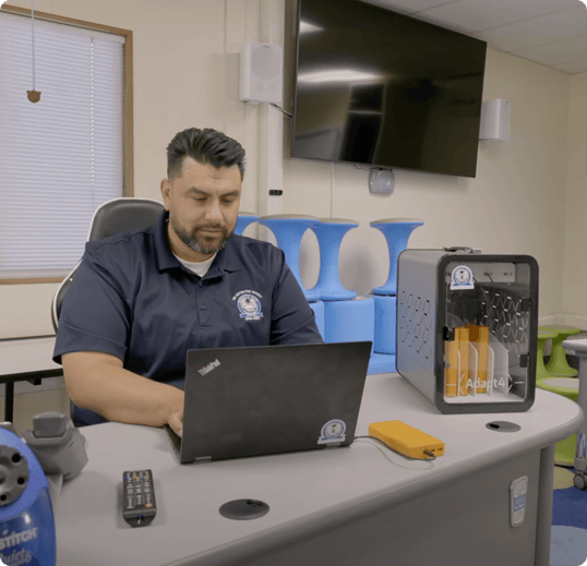Man working behind laptop