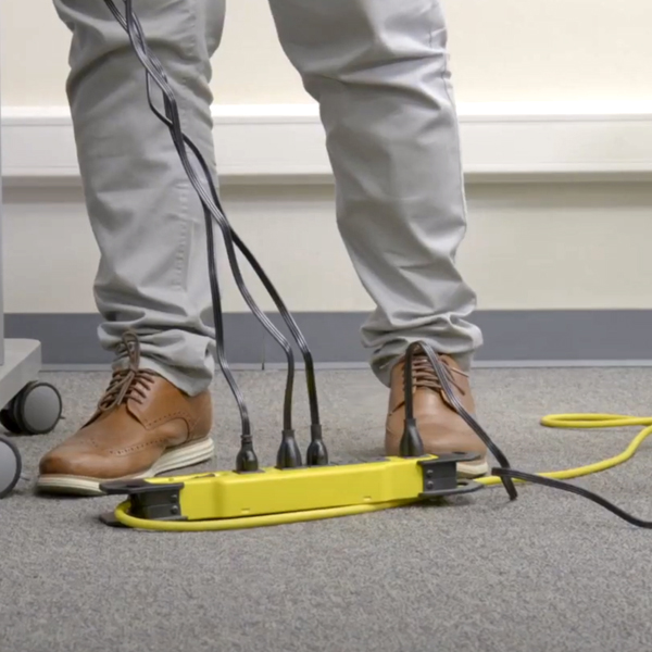 Power strip and cables on the floor