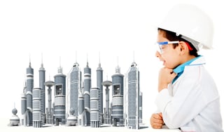 Young civil engineer with a city model - isolated over a white background.jpeg